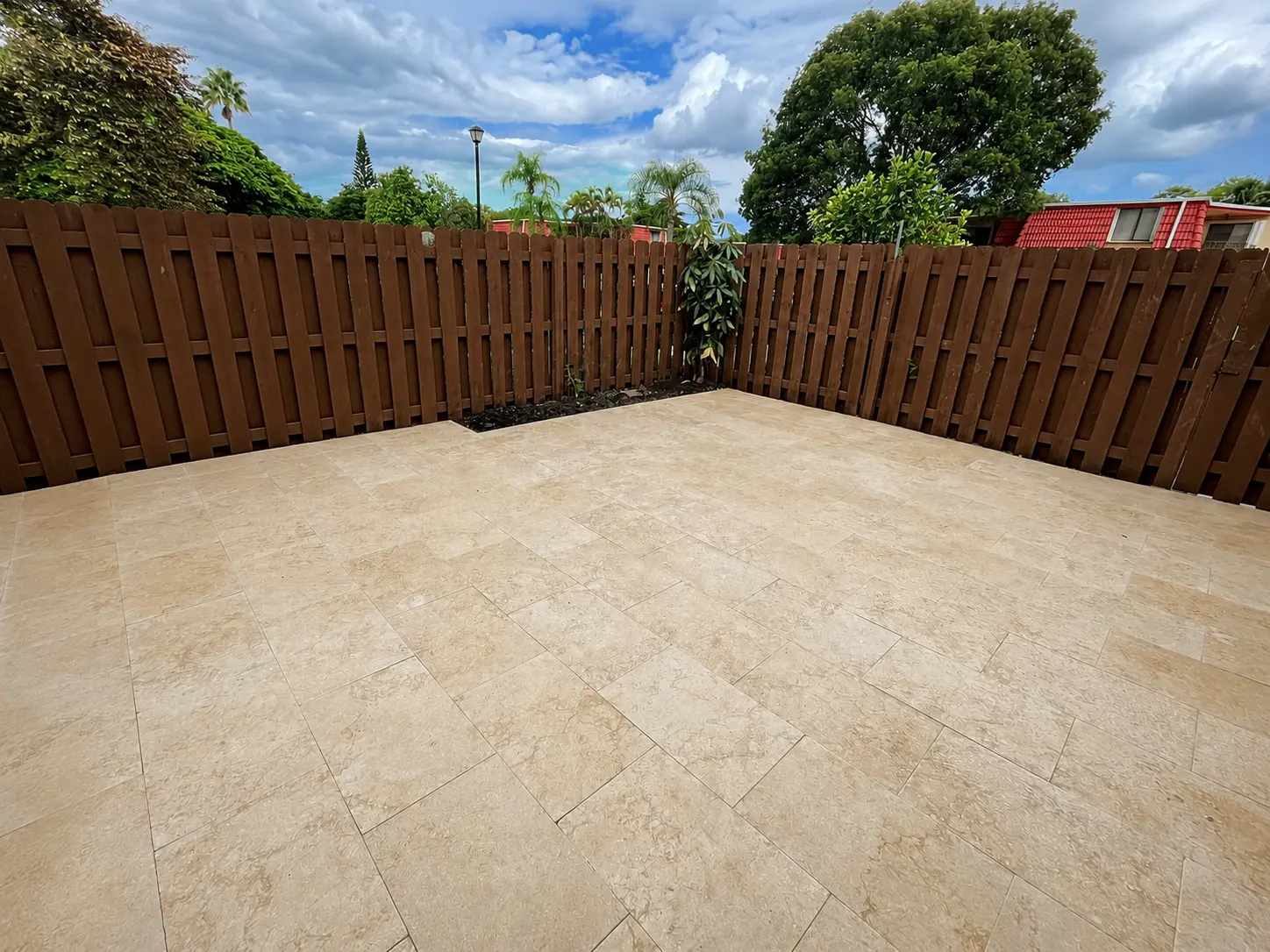 Travertine patio installation by Forben Construction